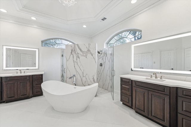 bathroom featuring crown molding, separate shower and tub, a chandelier, vanity, and a raised ceiling