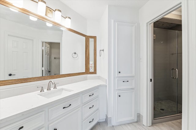 bathroom with vanity and walk in shower