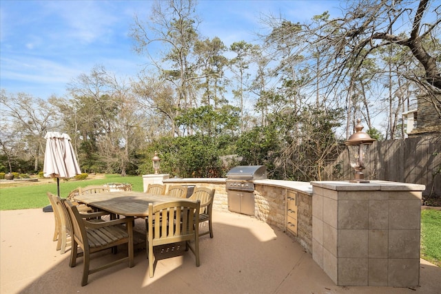 view of patio with area for grilling and grilling area