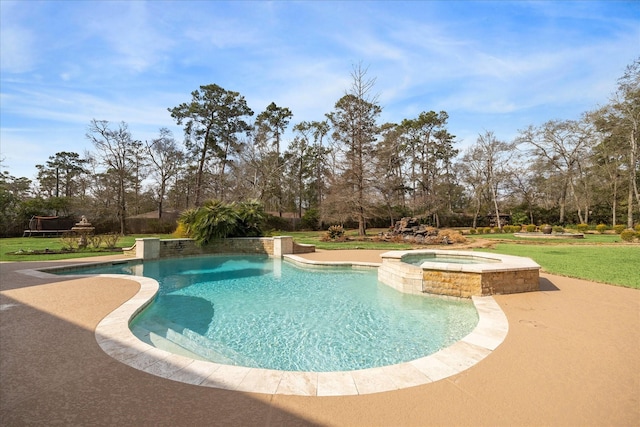 view of pool with an in ground hot tub and a lawn