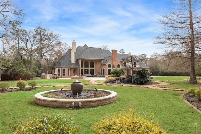 rear view of house with a lawn