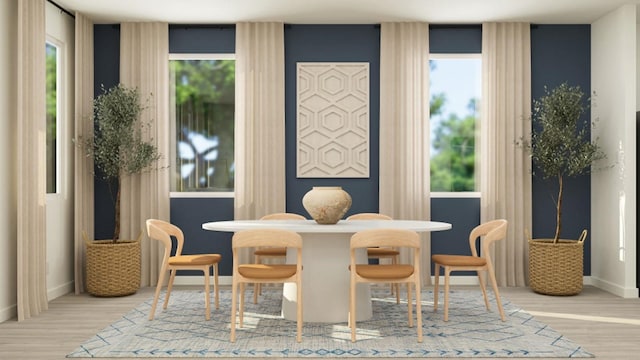 dining space with light wood-type flooring