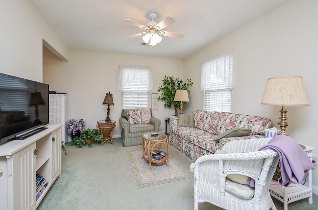 11943 Fawnview Dr, Houston, TX 77070 - carpeted living area with healthy amount of natural light, ceiling fan, and baseboards