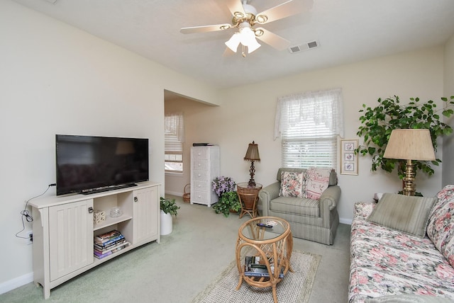 11943 Fawnview Dr, Houston, TX 77070 - living area featuring light colored carpet, baseboards, and a ceiling fan