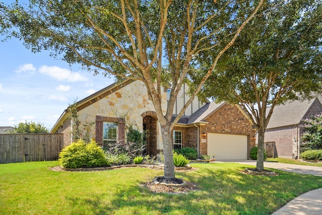 view of front facade featuring a garage and a front lawn