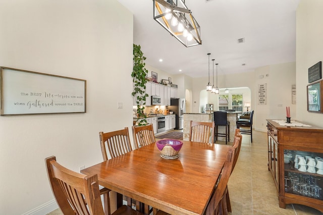 dining space with light tile patterned floors