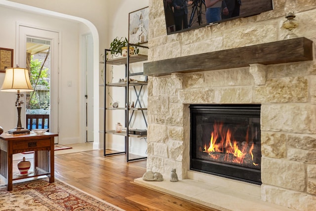 details with a fireplace and hardwood / wood-style floors