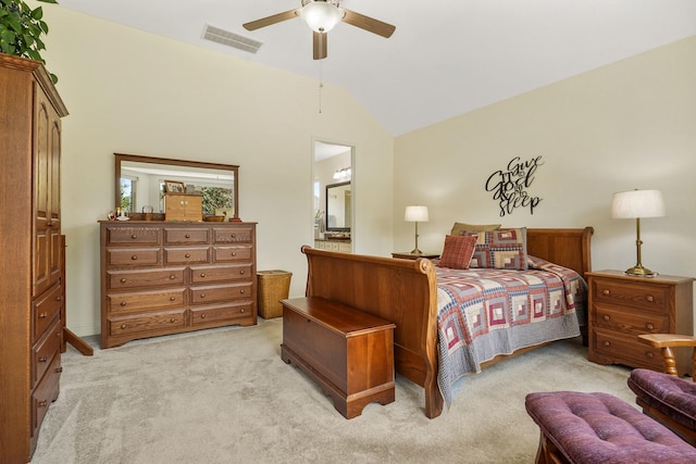 bedroom with ceiling fan, vaulted ceiling, and light carpet