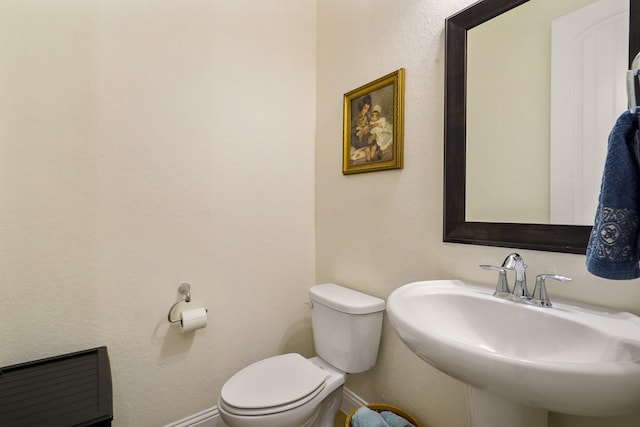 bathroom featuring sink and toilet