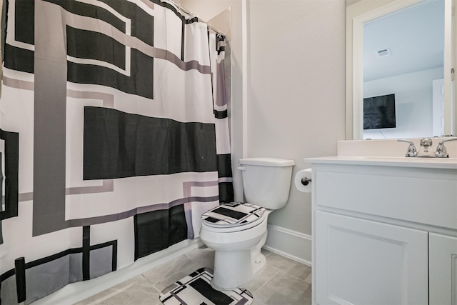 bathroom featuring vanity, tile patterned flooring, a shower with curtain, and toilet