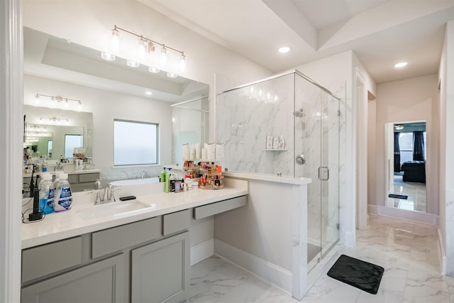 bathroom featuring vanity and a shower with shower door