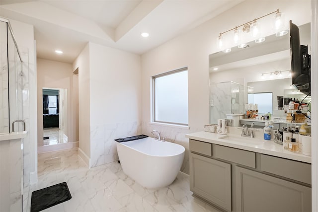 bathroom featuring vanity, separate shower and tub, and tile walls