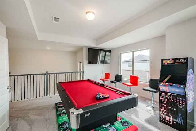 playroom featuring a tray ceiling, pool table, and carpet