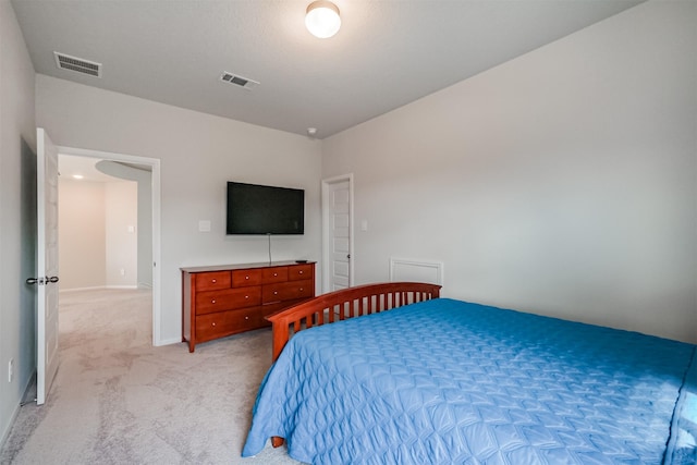 bedroom with light colored carpet