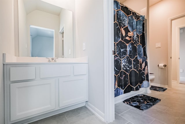 bathroom featuring lofted ceiling, tile patterned flooring, vanity, a shower with curtain, and toilet