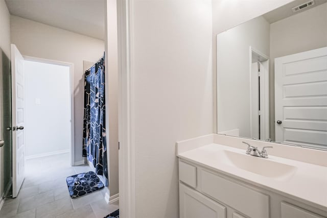 bathroom with vanity and tile patterned flooring