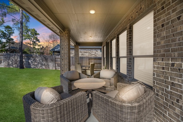 patio terrace at dusk with a lawn