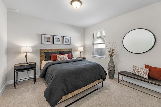 bedroom with light colored carpet