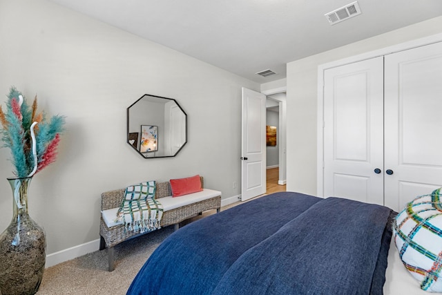 carpeted bedroom with a closet