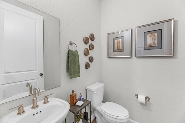 bathroom with sink and toilet