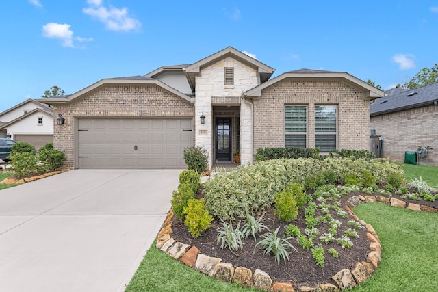 view of front of property featuring a garage and a front lawn