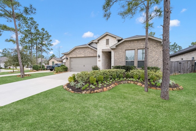 view of front of home featuring a garage and a front yard