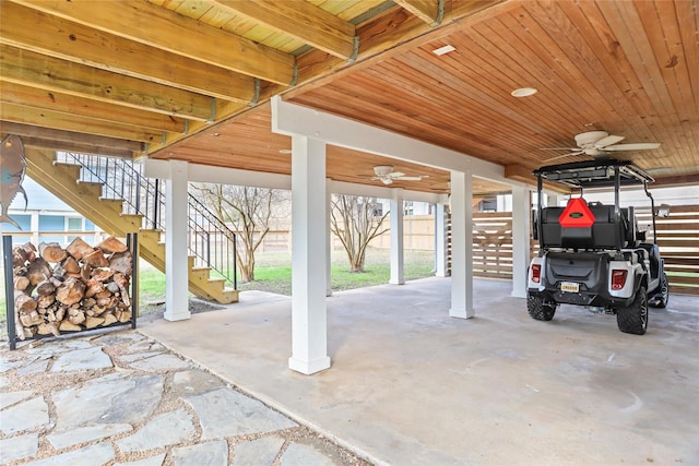 view of patio / terrace with a carport and ceiling fan