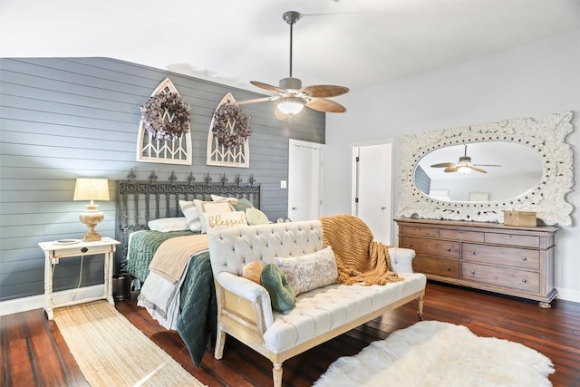 bedroom featuring ceiling fan, dark hardwood / wood-style floors, and vaulted ceiling