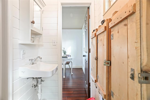 bathroom with wood-type flooring and sink