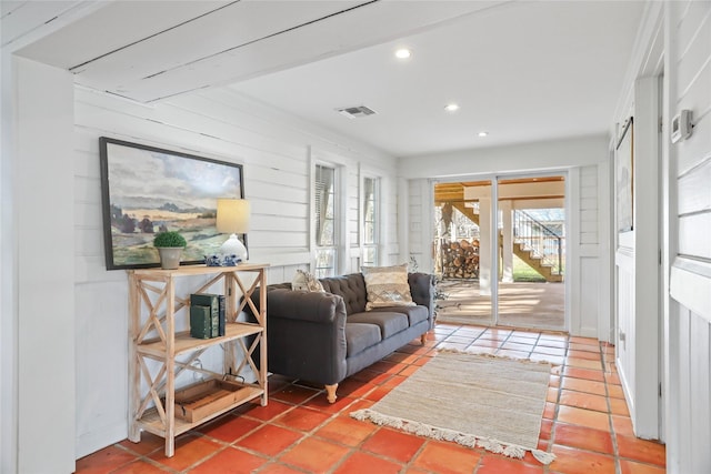 living room with tile patterned flooring