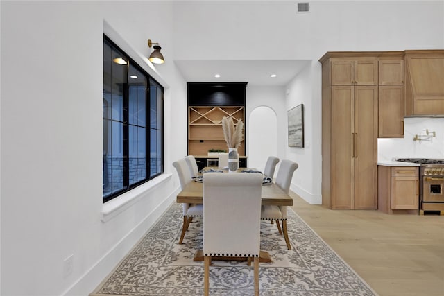 dining space with visible vents, recessed lighting, light wood-style flooring, and baseboards