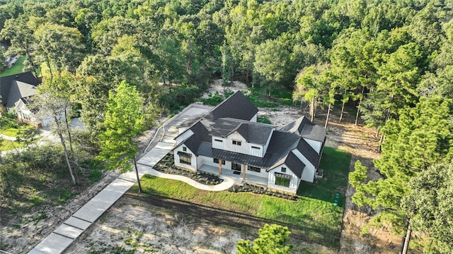 drone / aerial view with a view of trees