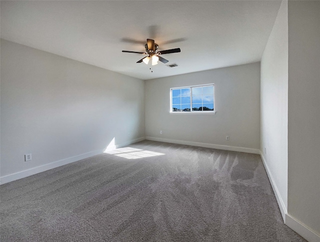 carpeted empty room with ceiling fan