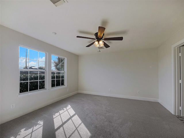 spare room featuring carpet and ceiling fan