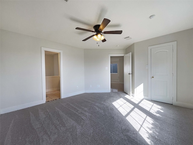 unfurnished bedroom featuring ceiling fan and light carpet