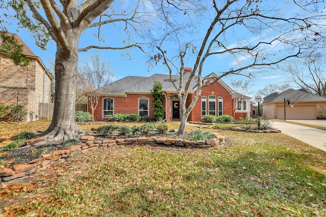 single story home featuring a front yard and a garage