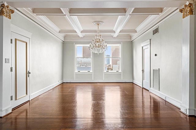 spare room featuring a chandelier, coffered ceiling, ornamental molding, dark hardwood / wood-style flooring, and beamed ceiling