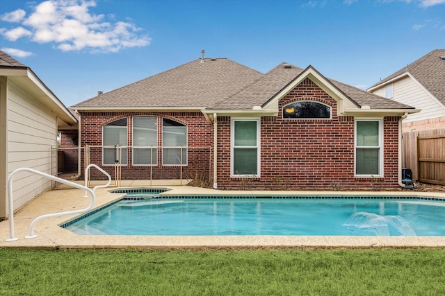 view of pool with an in ground hot tub