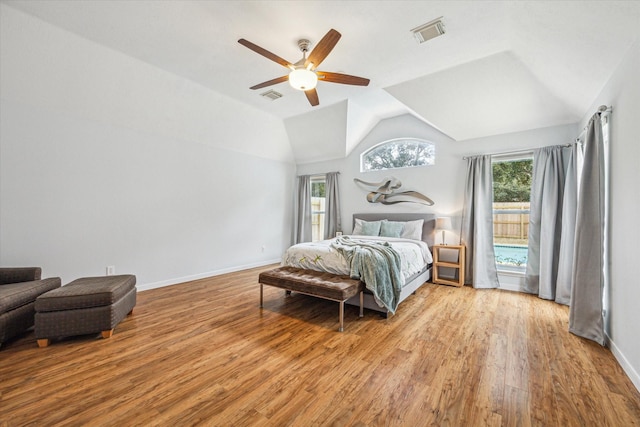 bedroom with vaulted ceiling, light hardwood / wood-style floors, and ceiling fan