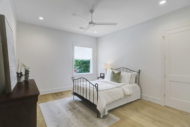 bedroom featuring ceiling fan and light hardwood / wood-style flooring