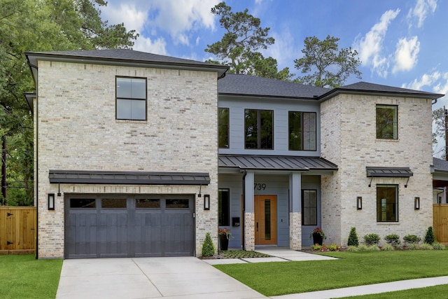 view of front facade with a garage and a front yard