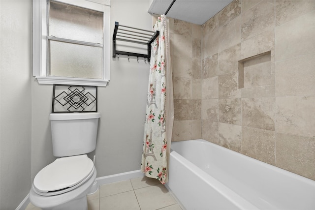 bathroom featuring shower / bathtub combination with curtain, tile patterned floors, and toilet