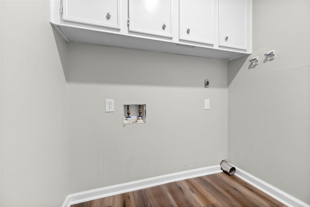 washroom featuring washer hookup, wood-type flooring, cabinets, and hookup for an electric dryer