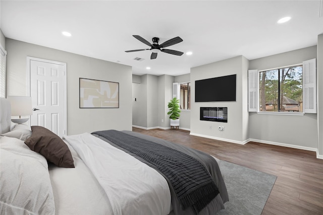 bedroom featuring wood-type flooring and ceiling fan