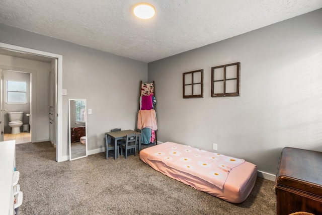 carpeted bedroom with a textured ceiling