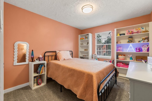 carpeted bedroom with a textured ceiling