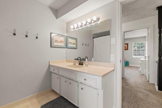 bathroom with vanity, a textured ceiling, and a shower with shower curtain