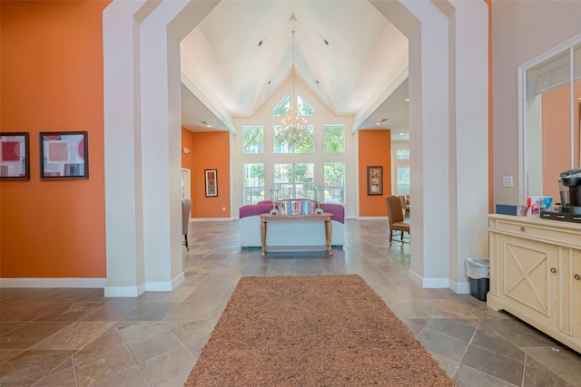 interior space with an inviting chandelier and high vaulted ceiling