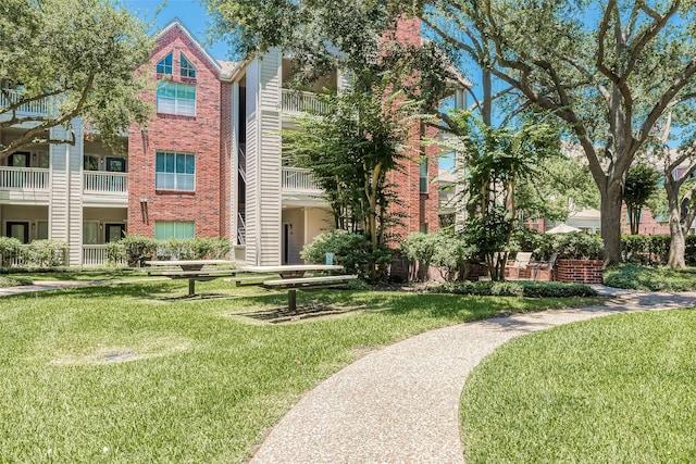 surrounding community featuring a yard