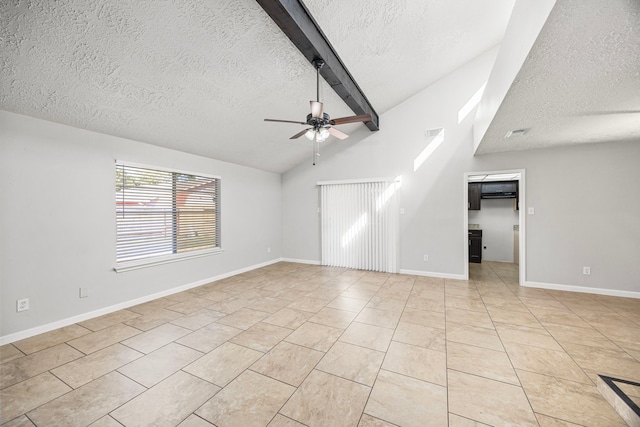 unfurnished living room featuring lofted ceiling with beams, ceiling fan, light tile patterned flooring, and a textured ceiling